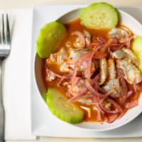 Aguachile · Raw shrimp cured in lime juice with choice of serrano 