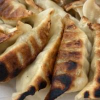 Pan Fried Dumplings · 15 pieces Crispy, pan fried chicken and vegetable dumplings!