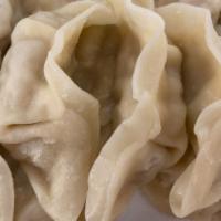 Steamed Dumplings · 15 pieces Piping hot, steamed chicken and vegetable dumplings!