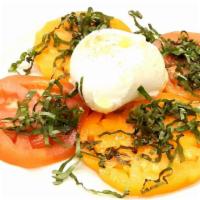 Caprese · Fresh buffalo style (pasteurized) mozzarella cheese with sliced mixed tomatoes and fresh bas...