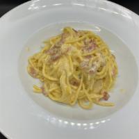 M. Spaghetti Carbonara · Homemade Spaghetti with eggs, Guanciale (pig cheek) and a touch of cream.