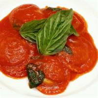 M. Ravioli Al Pomodoro · Homemade Ravioli stuffed with spinach and ricotta cheese 
Tomato and basil sauce