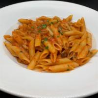 Penne Con Porcini (Red Tomato Sauce) · Penne with porcini mushrooms and garlic tomato sauce.