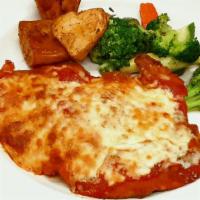 Veal Medallions Parmigiana · Pounded medallions of breaded natural veal topped and baked with Mozzarella cheese and tomat...