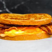 Sourdough, Double Bacon, Egg, & Cheddar   · 2 scrambled eggs, melted Cheddar cheese, double bacon, and Sriracha aioli on toasted sourdou...