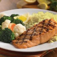 Grilled Salmon Fillet · A grilled salmon fillet garnished with a  fresh lemon wedge. Served with choice  of two dinn...