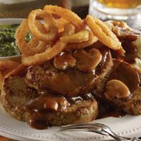 Classic Meatloaf · Home-style meatloaf topped with a rich gravy with mushrooms. Served with choice of two dinne...