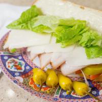 Turkey Sandwich · Turkey breast on a bed of chopped lettuce, tomatoes, onions, pickles, and topped off with pr...