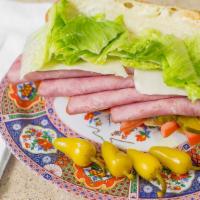 Ham Sandwich · Ham on a bed of chopped lettuce, tomatoes, onions, pickles, and topped off with provolone ch...