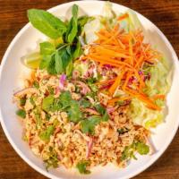 Larb · Finely chopped meat tossed with lime juice, onions, mint leaves, cilantro, green onion and t...