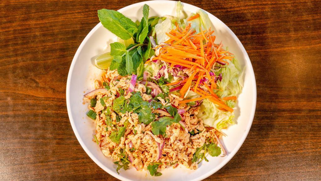 Larb · Finely chopped meat tossed with lime juice, onions, mint leaves, cilantro, green onion and toasted rice powder.