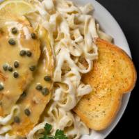 Chicken Picatta · Two chicken breast sautéed in a lemon white wine butter sauce with capers, served with fettu...