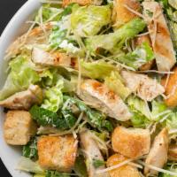 Chicken Caesar · Romaine lettuce, chicken, and croutons tossed in our homemade dressing. Topped with Parmesan...