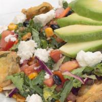 Southwestern Kale Salad  · Thinly sliced kale and cabbage topped with pico de gallo, roasted corn, black beans, avocado...