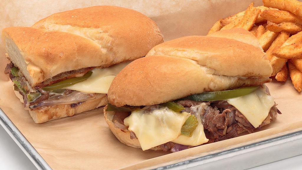 Philly Cheesesteak Sandwich · Layers of thinly sliced steak, grilled with red onions, green bell peppers and American Swiss cheese. Served on a warm hoagie roll.