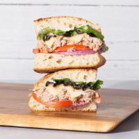 Tuna Melt · Tuna salad with melted cheddar cheese, sliced tomato, mixed greens, and aioli on your choice...