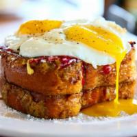 Country French Toast · Classic country french toast dusted with powdered sugar and served with farm fresh eggs, app...
