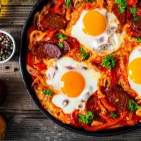 Chorizo & Eggs · Flavorful pork chorizo scrambled with farm fresh eggs topped with fresh pico de gallo and se...