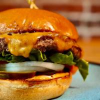 Ferds Burger · Beef patty w/ melted cheddar cheese, tomatoes, lettuce, onions, house pickles, house sauce o...