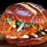 Honolulu Hot Chicken · The Honolulu Hot Chicken, features a crispy hot chicken tender, topped with pickled carrots ...