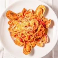 Cajun Seafood Fettuccine Pasta · Tender shrimp, scallops, mussels, and clam sauteed with red-green peppers, sun-dried tomatoe...
