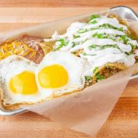 Chilaquiles · Tortilla chips with beans, melty queso fresco, sour cream, onion and cilantro.