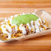 Carne Asada Fries · French fries with carne asada, cheddar cheese, guacamole and sour cream.