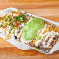 Nachos · Crispy tortilla chips with refried beans, melted cheddar and mozzarella cheese, pico de gall...