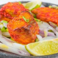 Fish Tikka Grill · Grilled fish marinated in garlic and spices