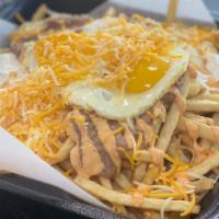 * Wake Up Fries · 2 eggs, steak, cheese, sour cream, chipotle sauce and beans