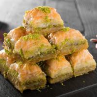 Pistachio Baklava (1 Piece) · Layers of pastry, filled with chopped pistachio and sweetened with syrup.
