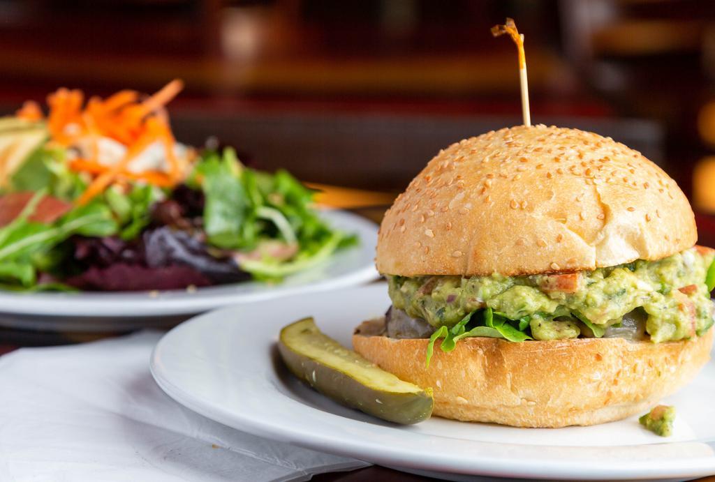 Spicy Guacamole Cheeseburger · 1/2 lb Niman Ranch beef with homemade spicy guacamole, fresh jaleoeno mayo, lettuce, Pepper Jack cheese and pickles on side. Choice of fries or spring mix salad.