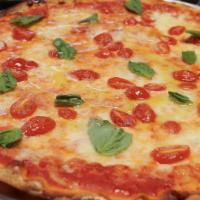 Margherita · Pizza sauce fresh basil, tomato and mozzarella.