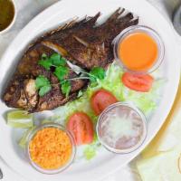 Fried Tilapia Plate · Mexican style, Fried Tilapia (Whole) served with 2 sides of your choice, tortillas,  side sa...