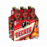 Tecate Mexican Beer 6 Bottles | 4% Abv · Easy to drink with a slightly sweet hint of corn.
