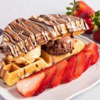 Ice Cream Waffle · Waffle served with vanilla and chocolate ice cream, topped with your choice of chocolate and...