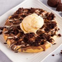 Brownies Waffle · Waffle topped with your choice of chocolate, topped with brownie crumbs. Served with vanilla...