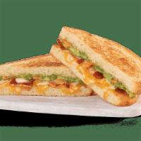 Avocado Grilled Cheese · white American cheese, firehouse cheese blend, bacon, smoked tomato spread and smashed avoca...