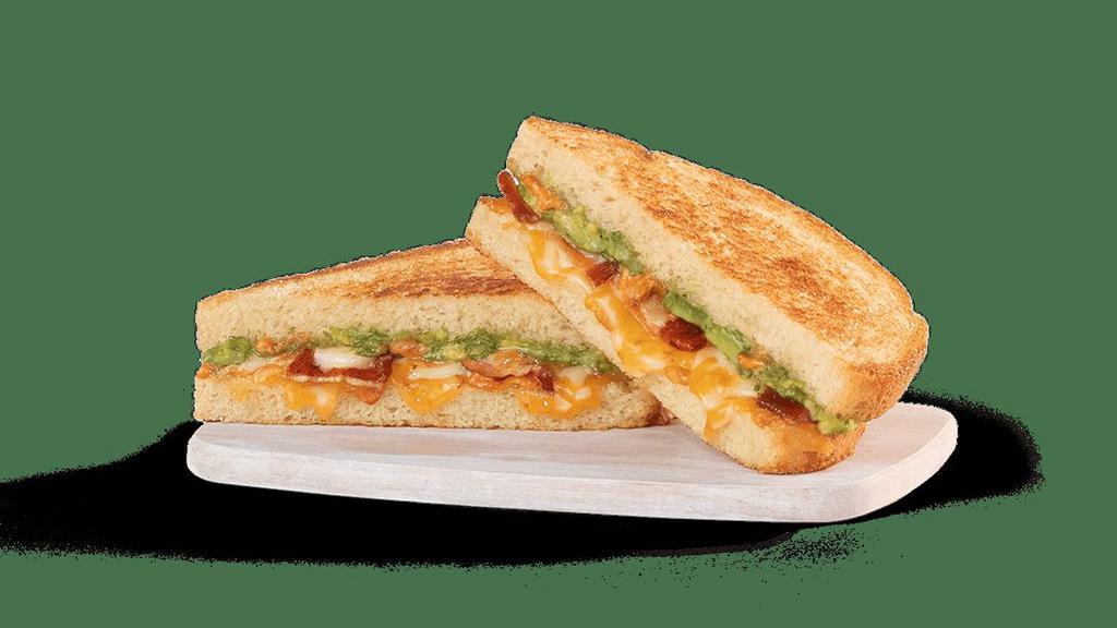 Avocado Grilled Cheese · white American cheese, firehouse cheese blend, bacon, smoked tomato spread and smashed avocado on toasted sourdough.