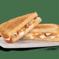 Smoky Grilled Cheese · fresh mozzarella, white American cheese, bacon and smoked tomato spread on toasted sourdough.