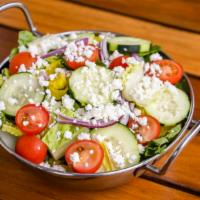House · Crisp romaine with tomato, cucumber, red onion, pepper rings and feta.