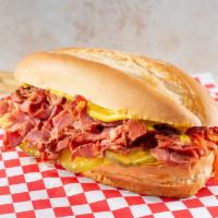 Pastrami Sandwich · Pastrami on a french roll with pickles and mustard.