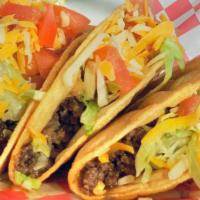 Hard Shell Gound Beef Tacos · Three Hard Shell ground beef Tacos.