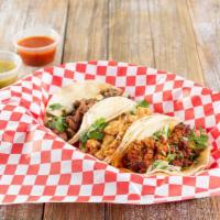 Tacos · Three tacos.
Carne Asada, Chicken, Chorizo or Fried Fish