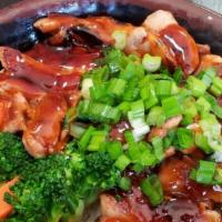 Teriyaki Chicken · Inside: dark chicken, broccoli, carrot, teriyaki sauce.  Served over rice.  Green onion only...
