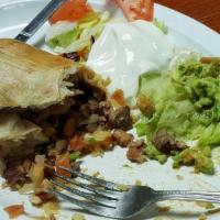 Chimichanga · Deep fried burrito, your choice of meat, rice, beans, cheese and pico de gallo, guacamole, s...