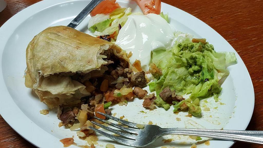 Chimichanga · Deep fried burrito, your choice of meat, rice, beans, cheese and pico de gallo, guacamole, sour cream, and lettuce on the side.