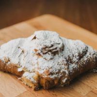 Almond Croissant · Twice-baked butter croissant filled with frangipane and Madagascar vanilla bean simple syrup...