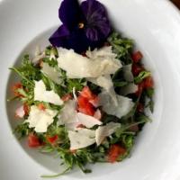 Arugula Salad · Wild arugula, oregano, lemon EVOO, shaved Parmigiano, chopped tomato.
