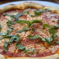 Margherita Pizza · Unique homemade Pomodoro sauce,
fresh mozzarella, fresh organic basil,
EVOO infused with ita...